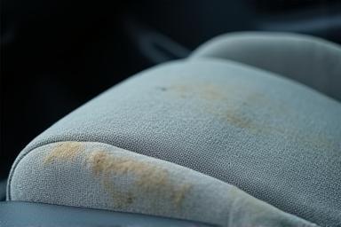 Stained car interior before cleaning